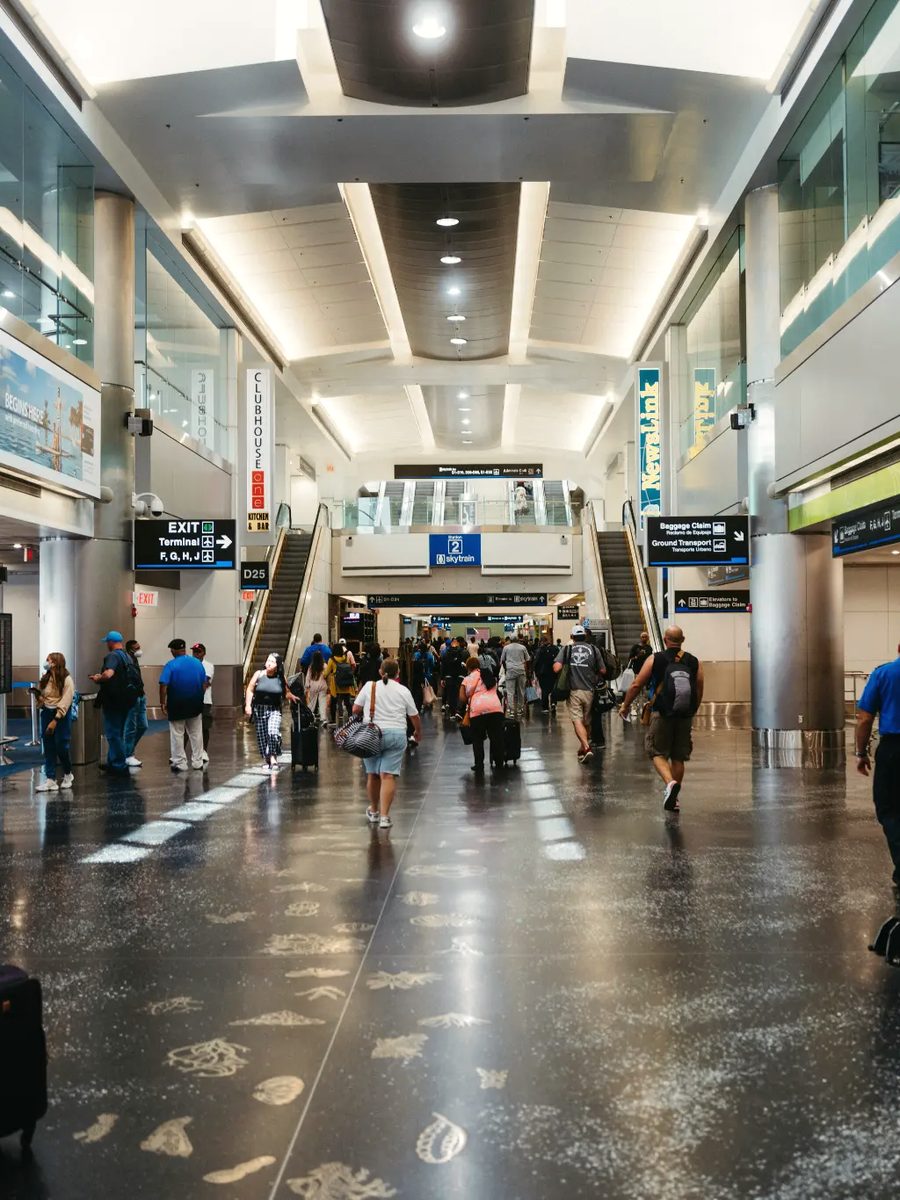 Travellers in a busy airport terminal