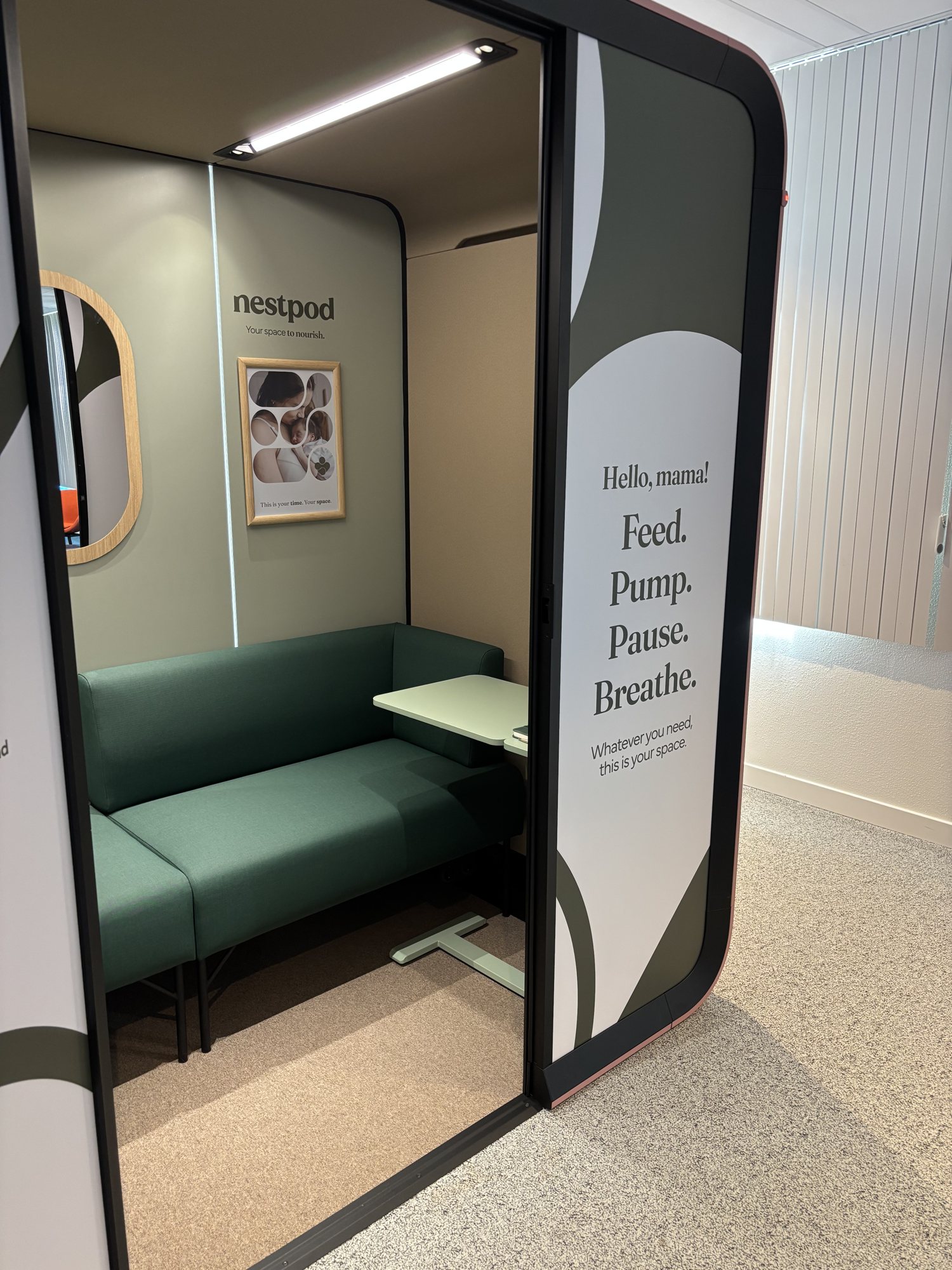 Inside a Nestpod: daybed, side table, mirror and soft light